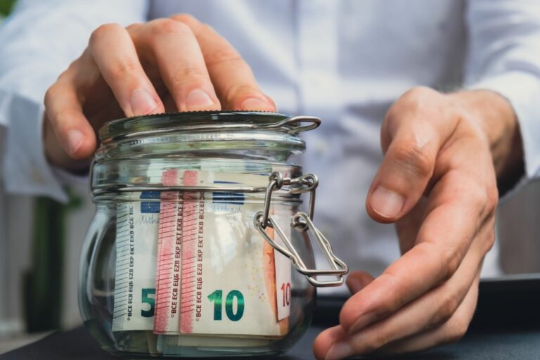 Euro,Banknote,Saving,Money,In,Glass,Jar.,Unrecognizable,Man,Moderate